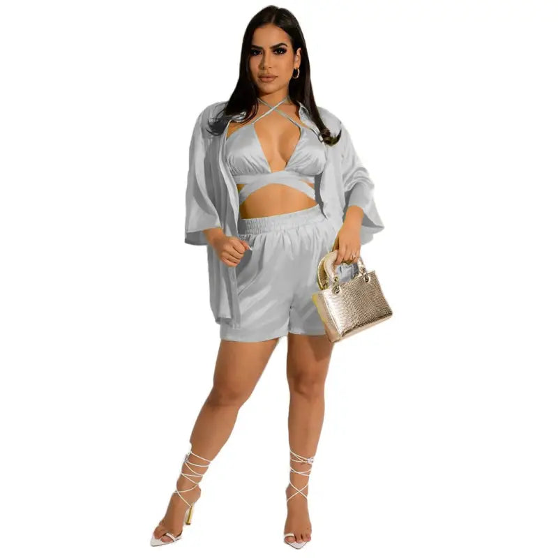 Woman in a cheerful & cute satin three-piece women clothing vest set for spring and fall