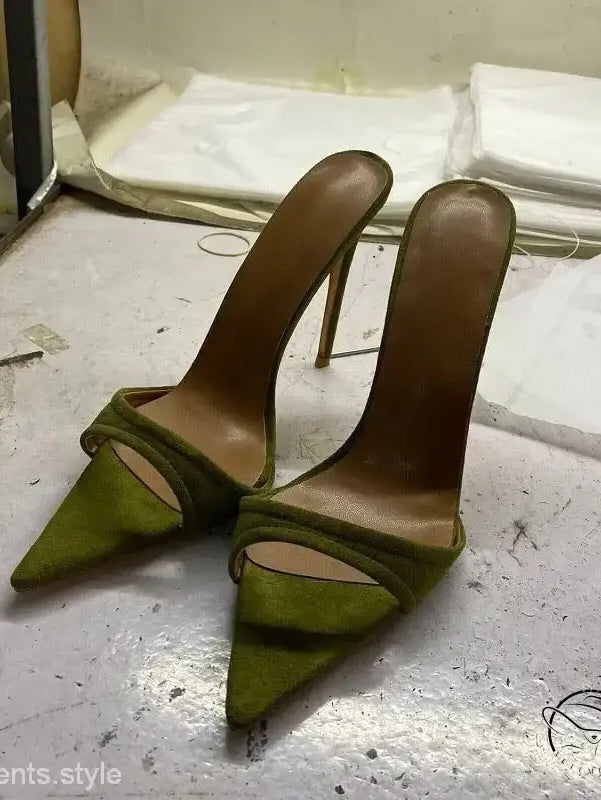 Pair of green pointed-toe chic summer slide stiletto pumps with thin straps