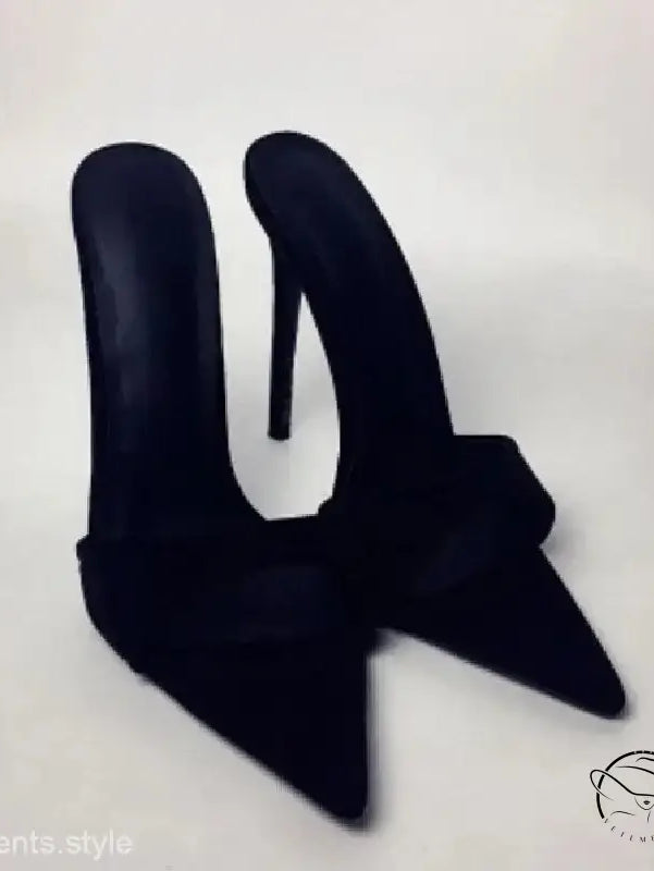 Pair of black pointed-toe stiletto pumps, chic summer slide style