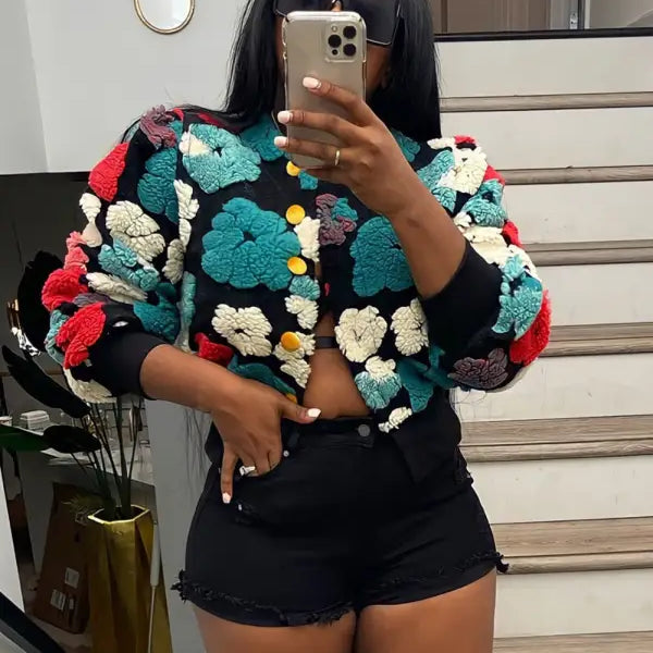 Rose red chrysanthemum floral print jacket with pom-pom sweater and black shorts
