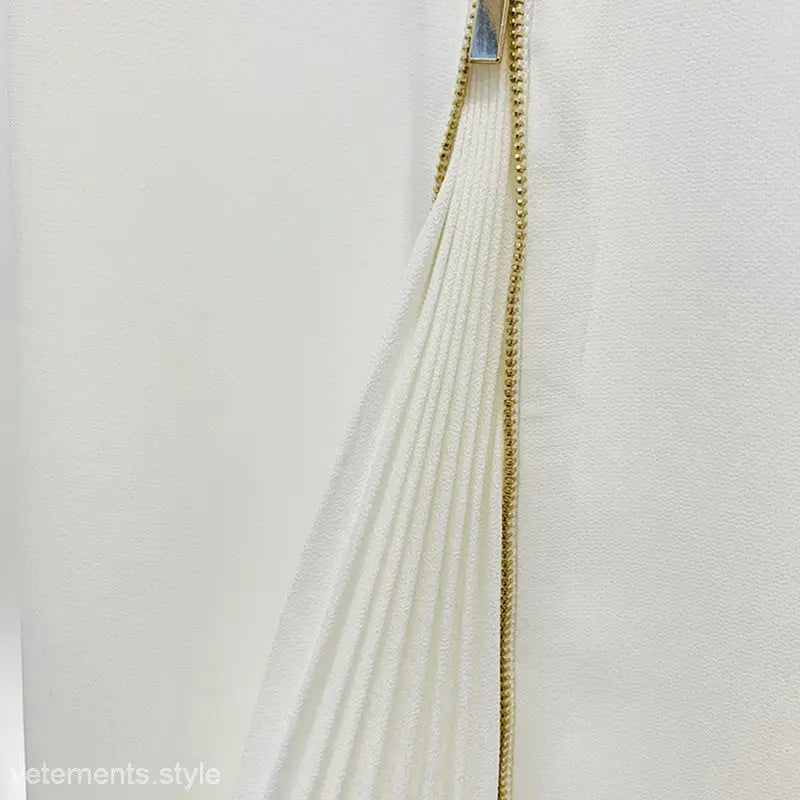 White pleated fabric with gold zipper on Clara Blazer Suit and Zipper Trousers Lace