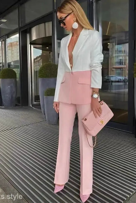 Stylish woman in white and pink blazer suit set with blue stitching color details