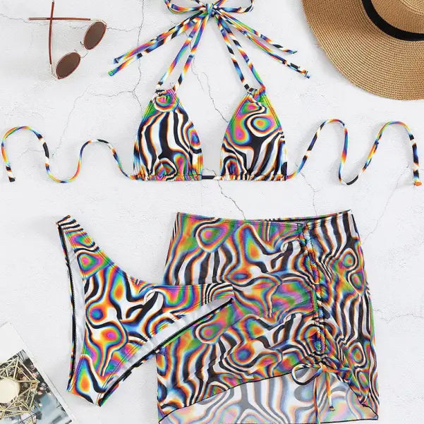 Colorful bikini three piece set with abstract psychedelic pattern and matching sarong