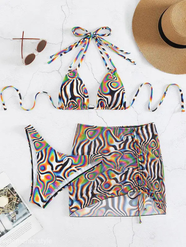 Colorful bikini three piece set with abstract psychedelic pattern and matching sarong