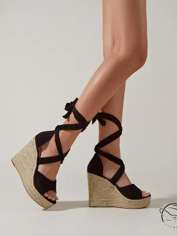 Pair of blue comfortable high heel sandals with cross tape design