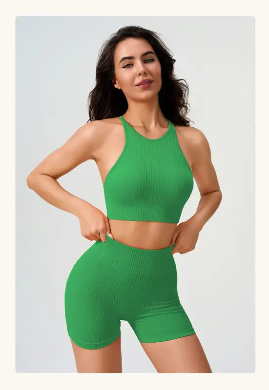 Woman in green ribbed workout set featuring Comfy High Waist Yoga Shorts in Peach Blossom Pink and Dark Coffee Color