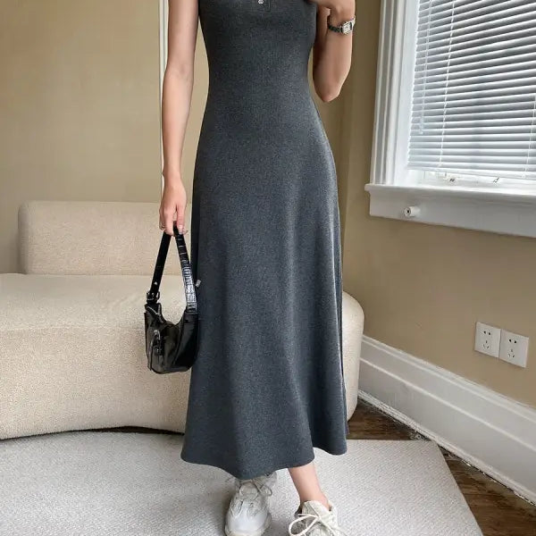 Long dark gray sleeveless slim outdoor dress with fitted bodice and flared skirt