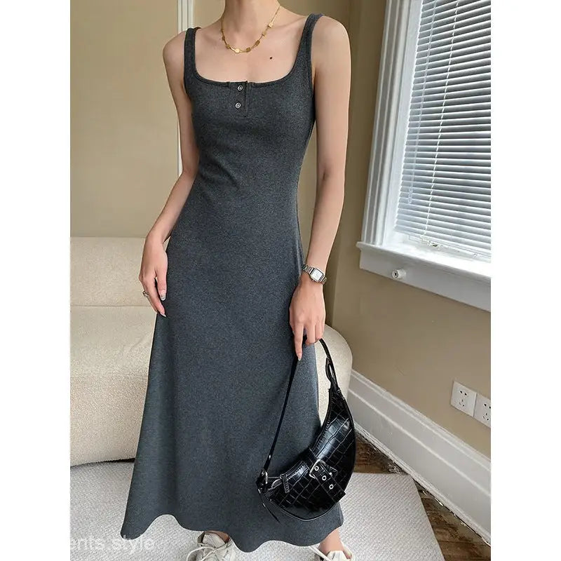 Sleeveless charcoal gray slim outdoor dress with square neckline and fitted silhouette