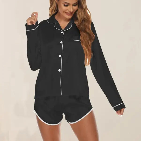 Black silk shorts pajamas with white piping, long-sleeved top and matching shorts