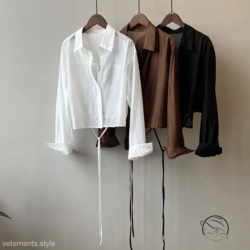 Three comfy sunrise cardigan shirts in white, brown, black on hangers