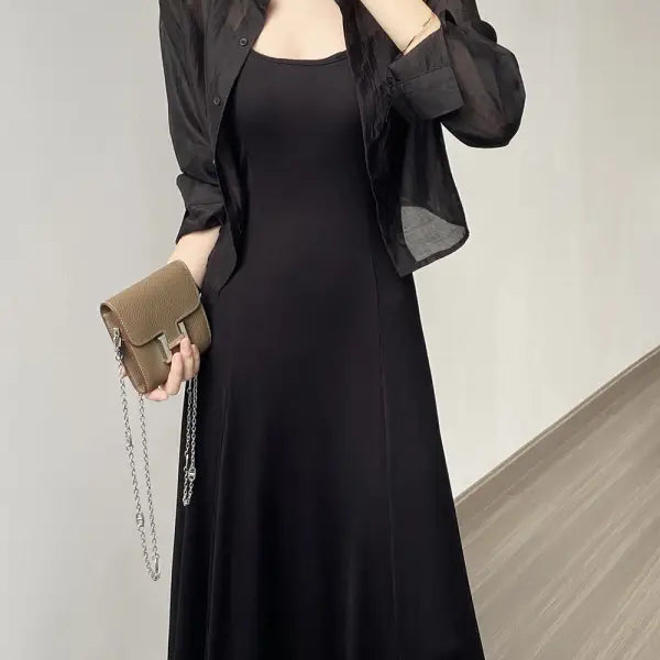 Elegant black maxi dress with sheer jacket and handbag, styled with Comfy Sunrise Cardigan