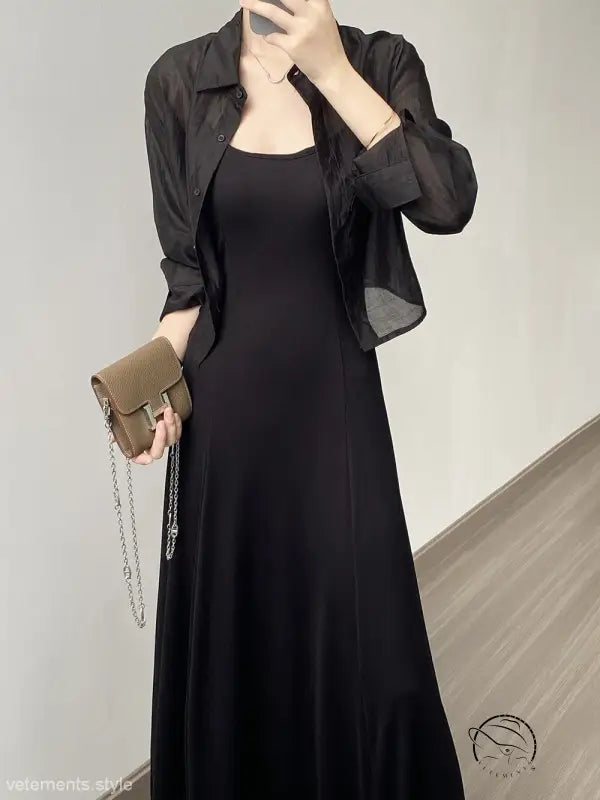 Elegant black maxi dress with comfy sunrise cardigan and brown handbag