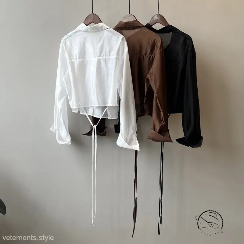 Three comfy sunrise cardigan shirts with ties on hangers