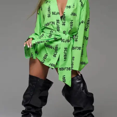 Woman in green robe and black boots showcasing comfy Vetements pajamas set with free shipping