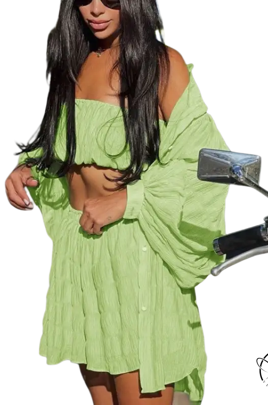 Woman in comfy white summer three-piece set next to motorcycle