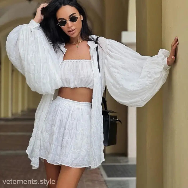 Woman in Comfy White Summer Three-Piece Set with Textured Button Top and stylish accessories