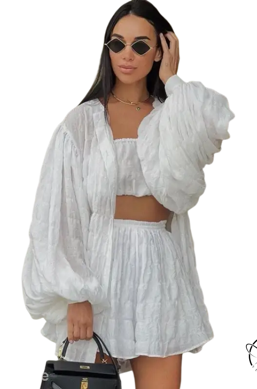 Woman in comfy white summer three-piece set with textured button top