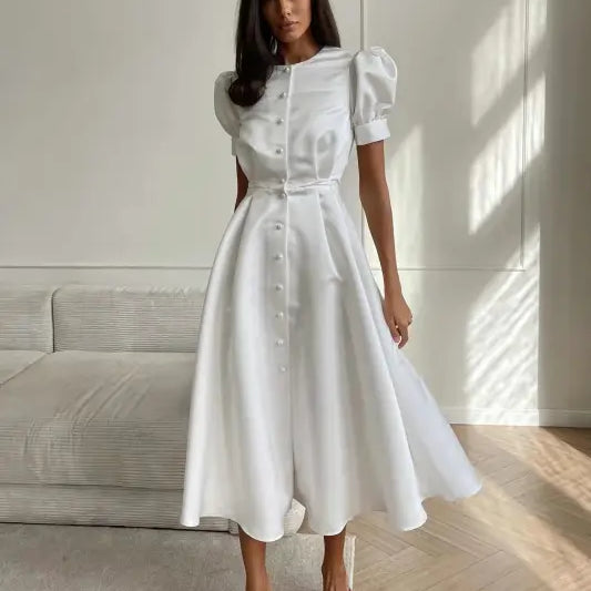 White midi dress with puff sleeves and button front, part of Coral Red Large Swing Line Dress collection