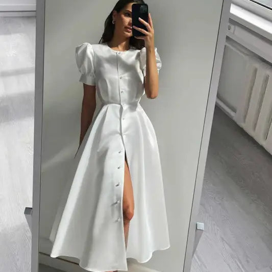 White button-front midi swing line dress with puffed sleeves and front slit