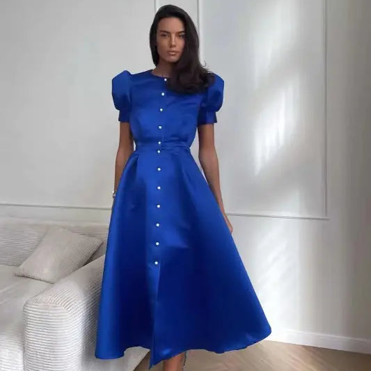 Vibrant blue midi swing line dress with puffed sleeves and button-down front
