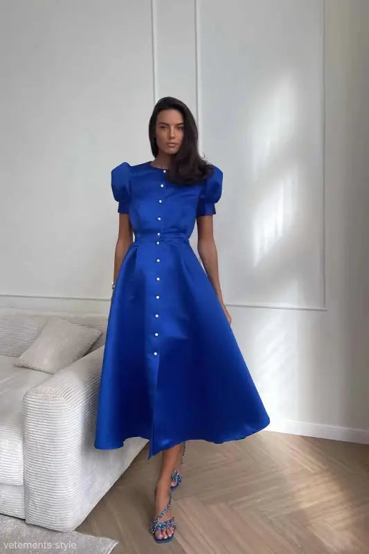 Vibrant blue midi swing line dress with puffed sleeves and button-down front