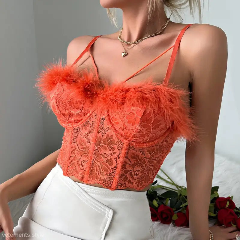 Coral red french lace corset with feather trim and cutout design for a sexy french lace look