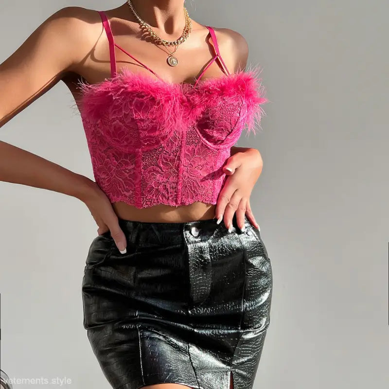 Pink lace and feather bustier with black patent leather mini skirt, part of the Coral Red French Lace Corset collection