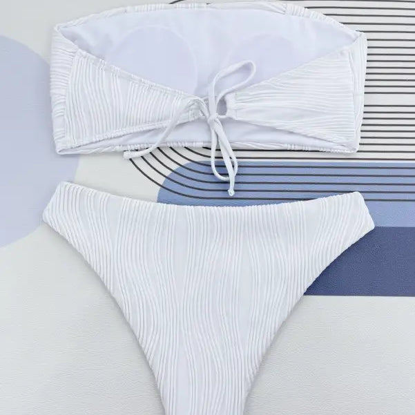 White ribbed three dimensional bikini set with bandeau top and high-cut bottom in Coral Red for summer vacations