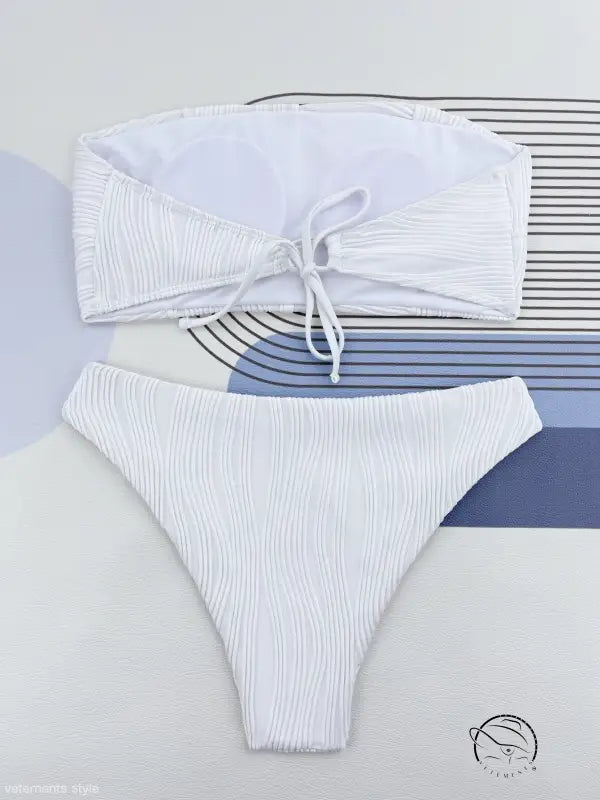 Coral red three dimensional bikini with white ribbed bandeau top and high-cut bottom