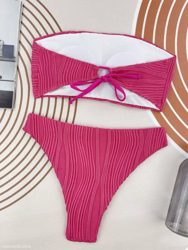 Hot pink textured three dimensional bikini with bandeau top and high-cut bottom for summer vacations