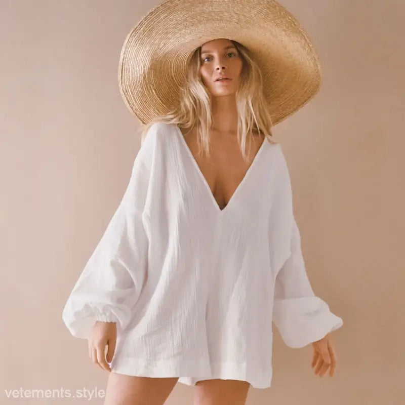 Woman wearing oversized white shirt and straw hat in cotton waist tight pajamas for lounging