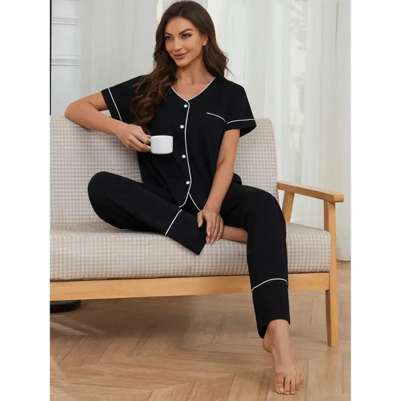 Black cozy short sleeved pajamas set with white piping, perfect for summer relaxation
