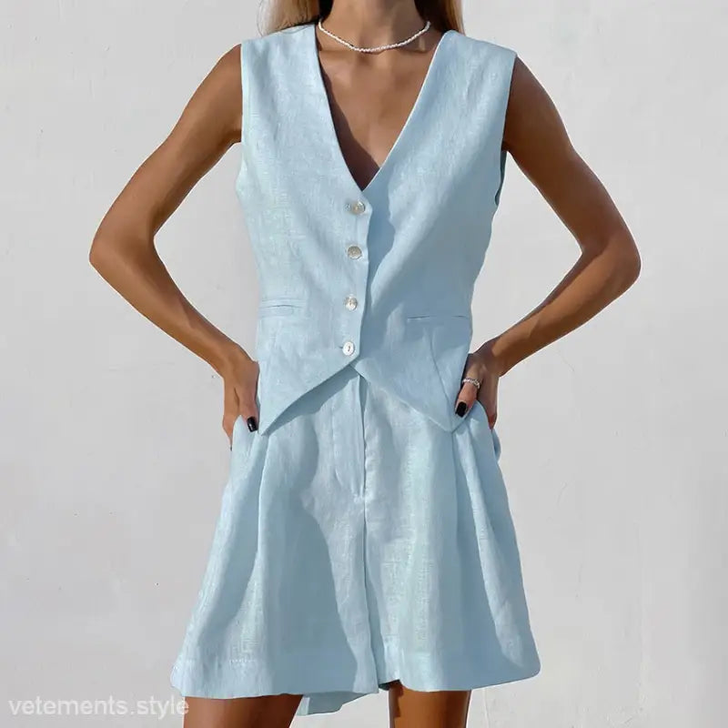 Light blue linen vest and shorts set complementing a dark green faux linen summer top