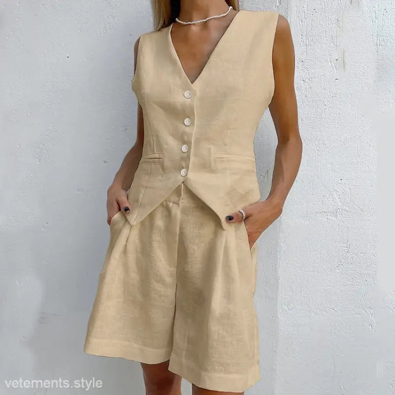 Beige linen vest and shorts set paired with dark green faux linen summer top