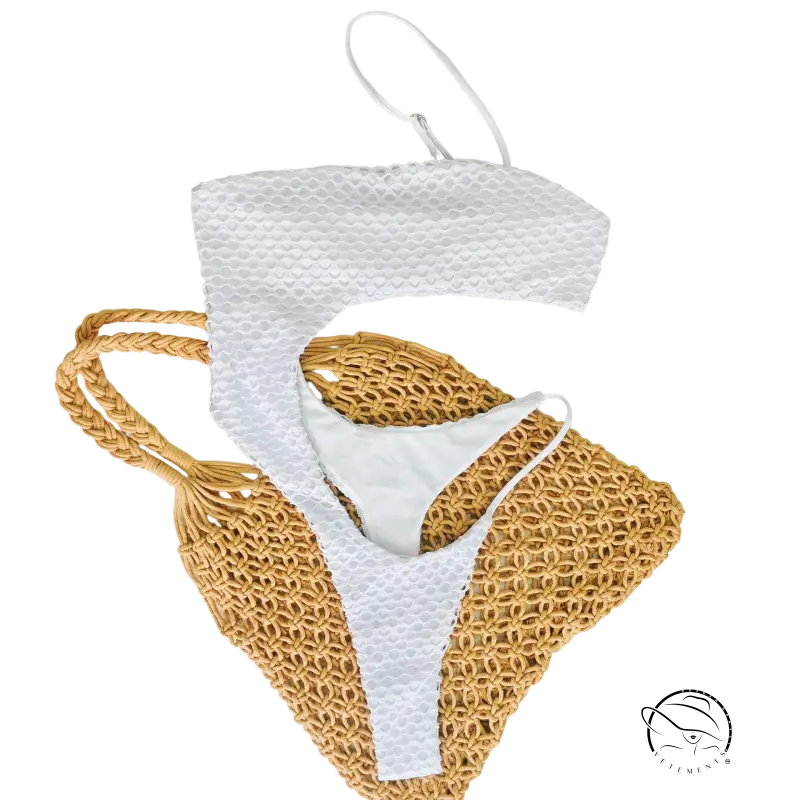 White diamond shaped swimwear bikini set on woven straw bag