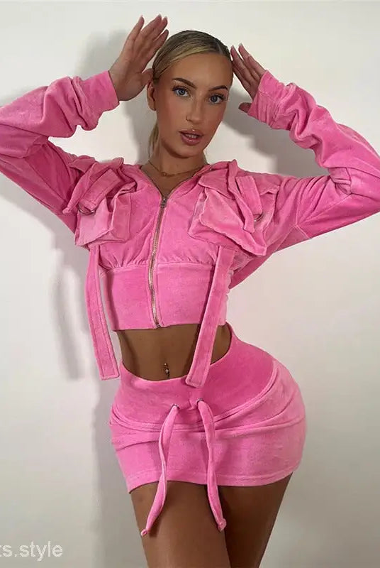 Woman modeling Dores Hooded Cardigan with personalized hooded pocket and stylish crop design