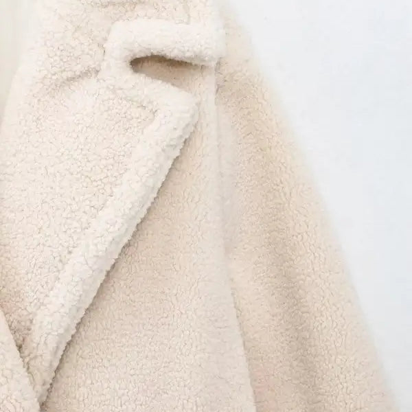 Cream-colored fluffy teddy coat in a double breasted casual fleece overcoat jacket