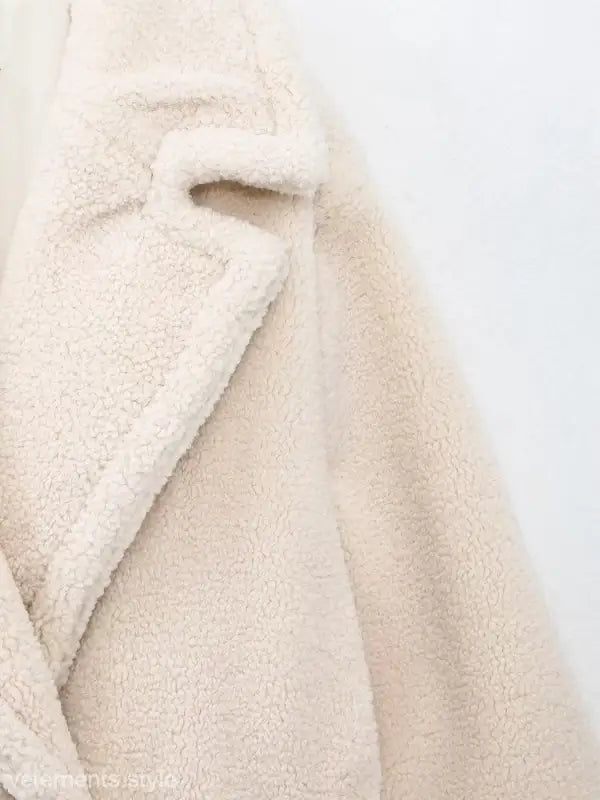 Cream-colored fluffy teddy coat in a double breasted casual fleece overcoat jacket
