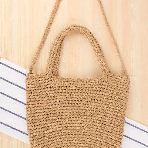 Handmade tan crocheted bohemian shoulder bag with essential care guidelines
