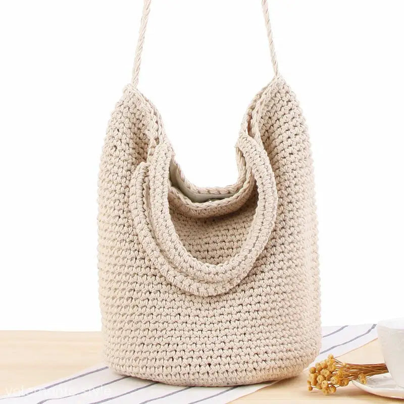 Crocheted beige tote bag featuring essential care guidelines for a durable Bohemian shoulder bag