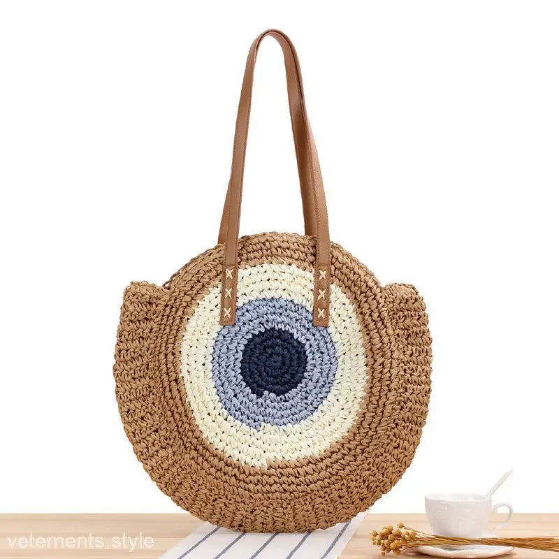 Circular straw beach bag with blue and white circles, ideal for a large striped blue or light brown Cross Bohemian Bag