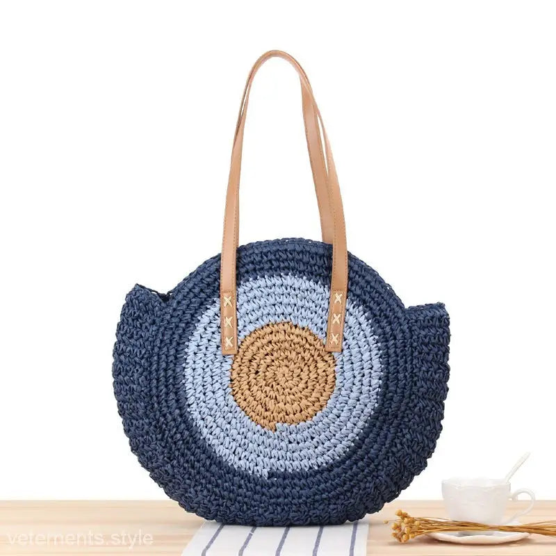 Circular crocheted handbag with navy and blue concentric rings for a large striped blue look