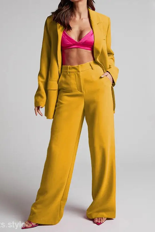 Woman wearing Edith Elegant Set, a spring collared high waist pantsuit with pink bra