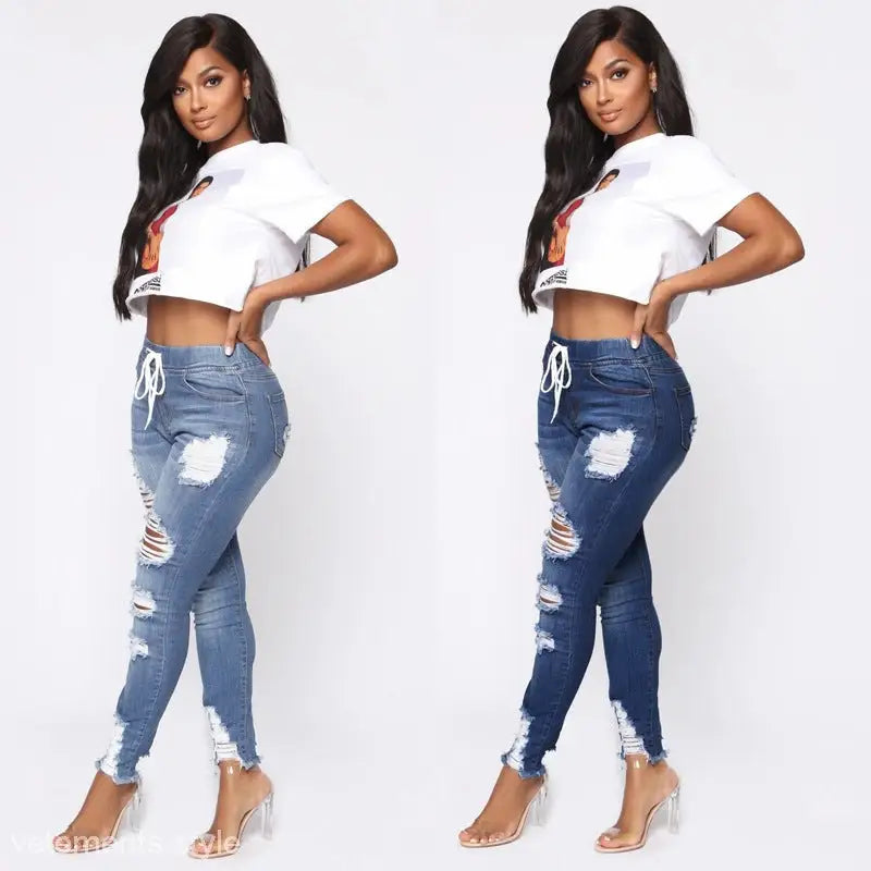 Two women showcasing Elastic Ripped Skinny Hip Raise Jeans in stylish crop tops