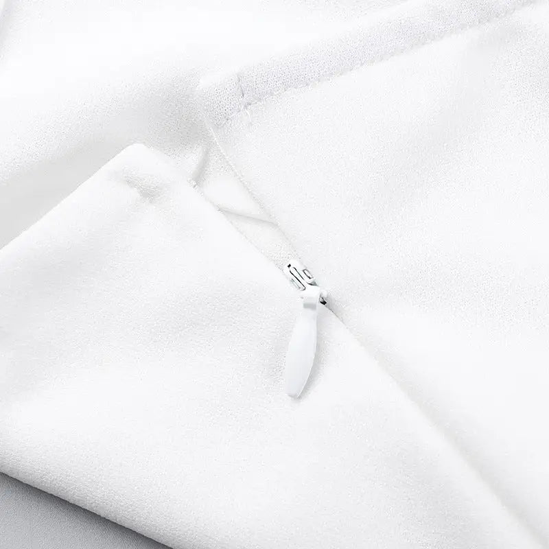 White zipper on a fabric surface.