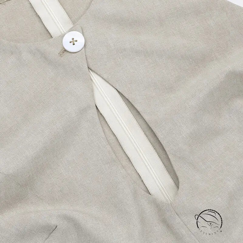 Close-up of elegant A-line midi dress with crew neck sleeve, white button, zipper