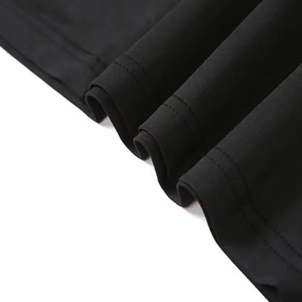 Black fabric showcasing rolled edges of a sexy low cut backless evening dress