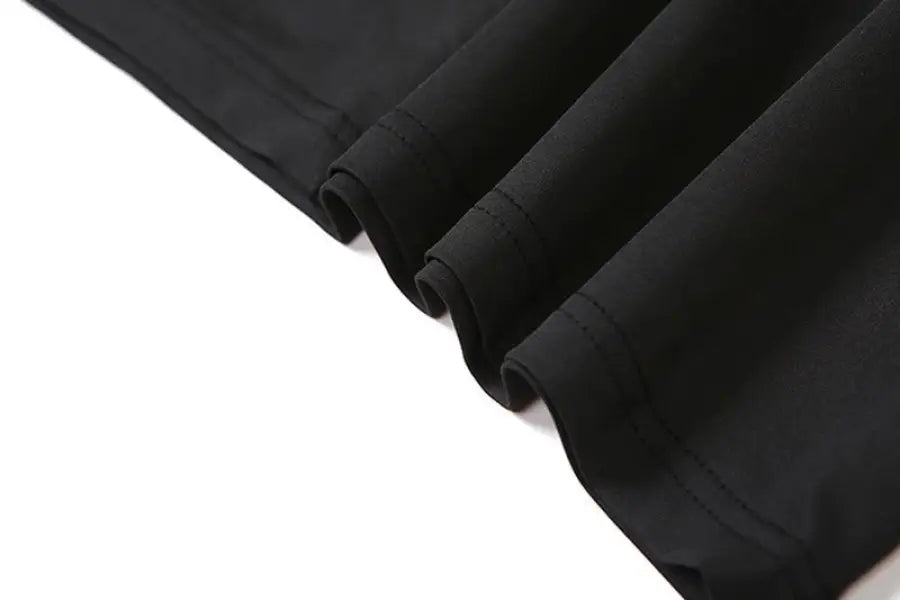 Black fabric showcasing rolled edges of a sexy low cut backless evening dress