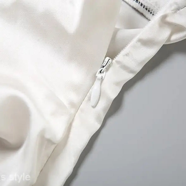 Elegant Backless Lace Split Dress featuring a white satin garment with zipper detail