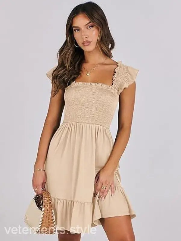 Beige smocked bodice backless short mini dress with ruffle detail for a sexy backless short look